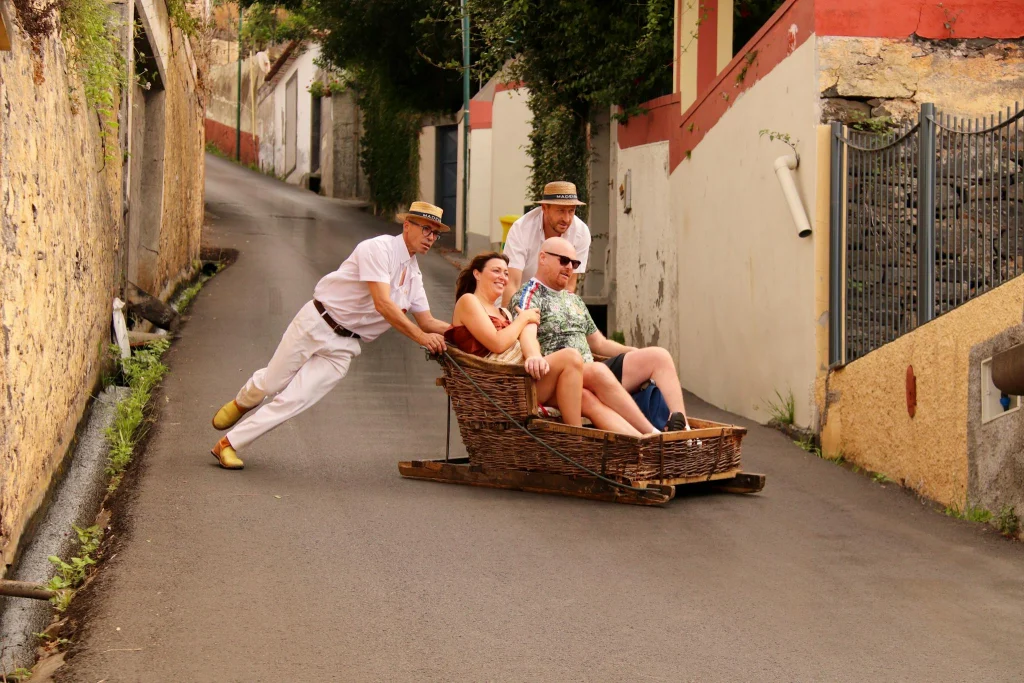Experience the thrilling traditional wicker toboggan ride down Funchal's steep streets in Madeira, Portugal.