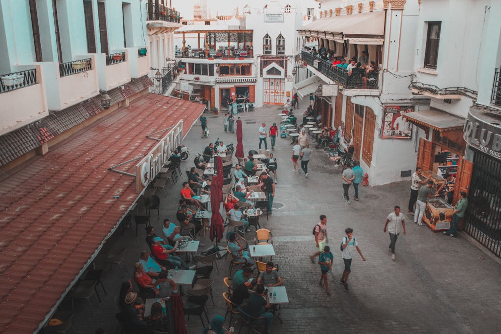 High angle view of a bustling outdoor cafe in Tanger, Morocco, showcasing urban life.